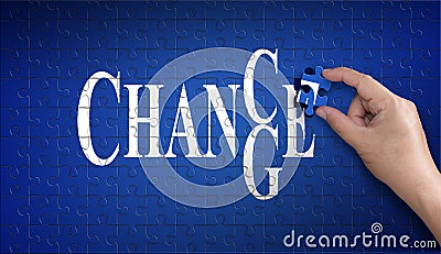 Chance to change word on Jigsaw puzzle. Man hand holding a blue Stock Photo